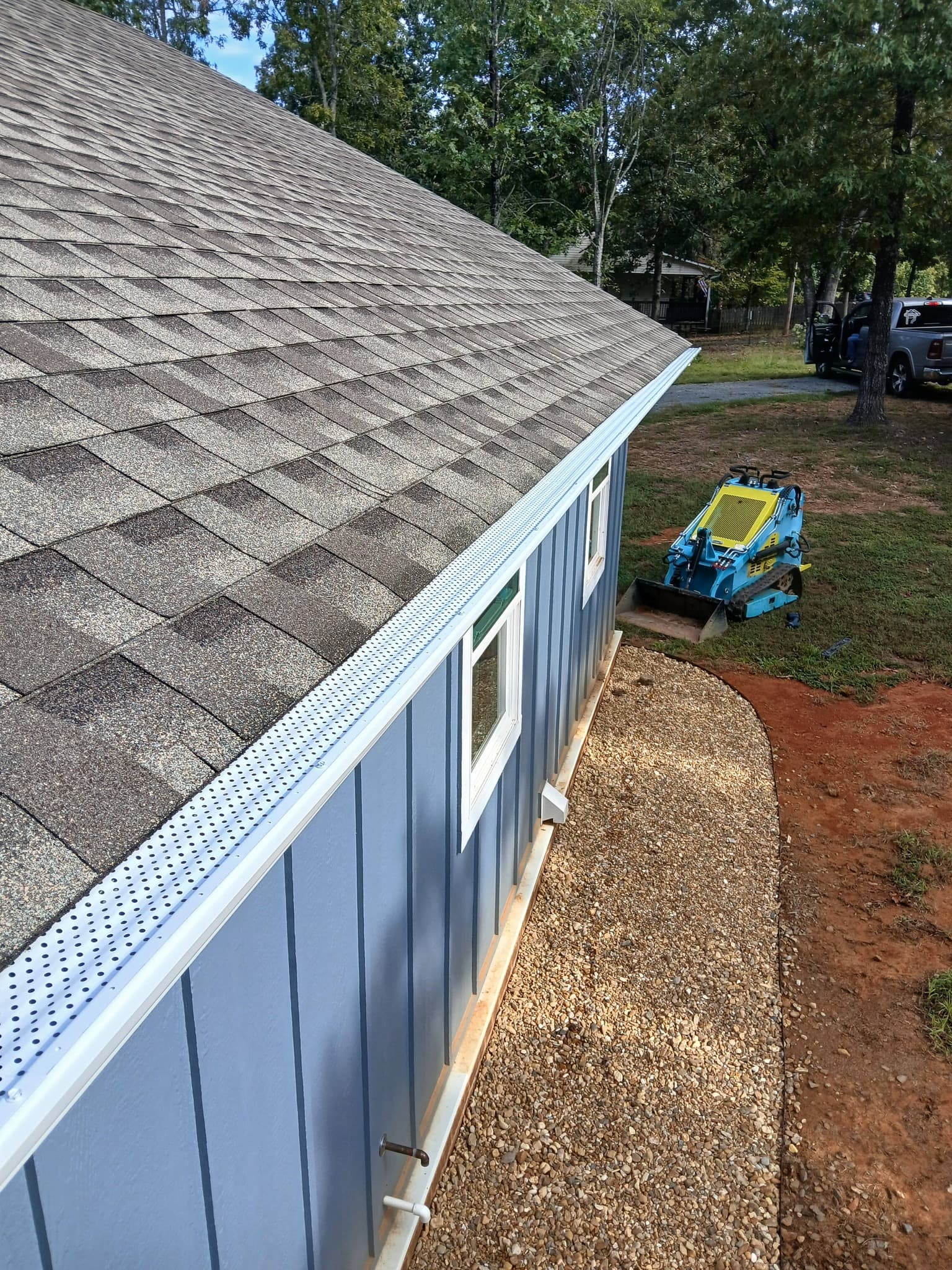 Seamless gutter installation with gutter guards